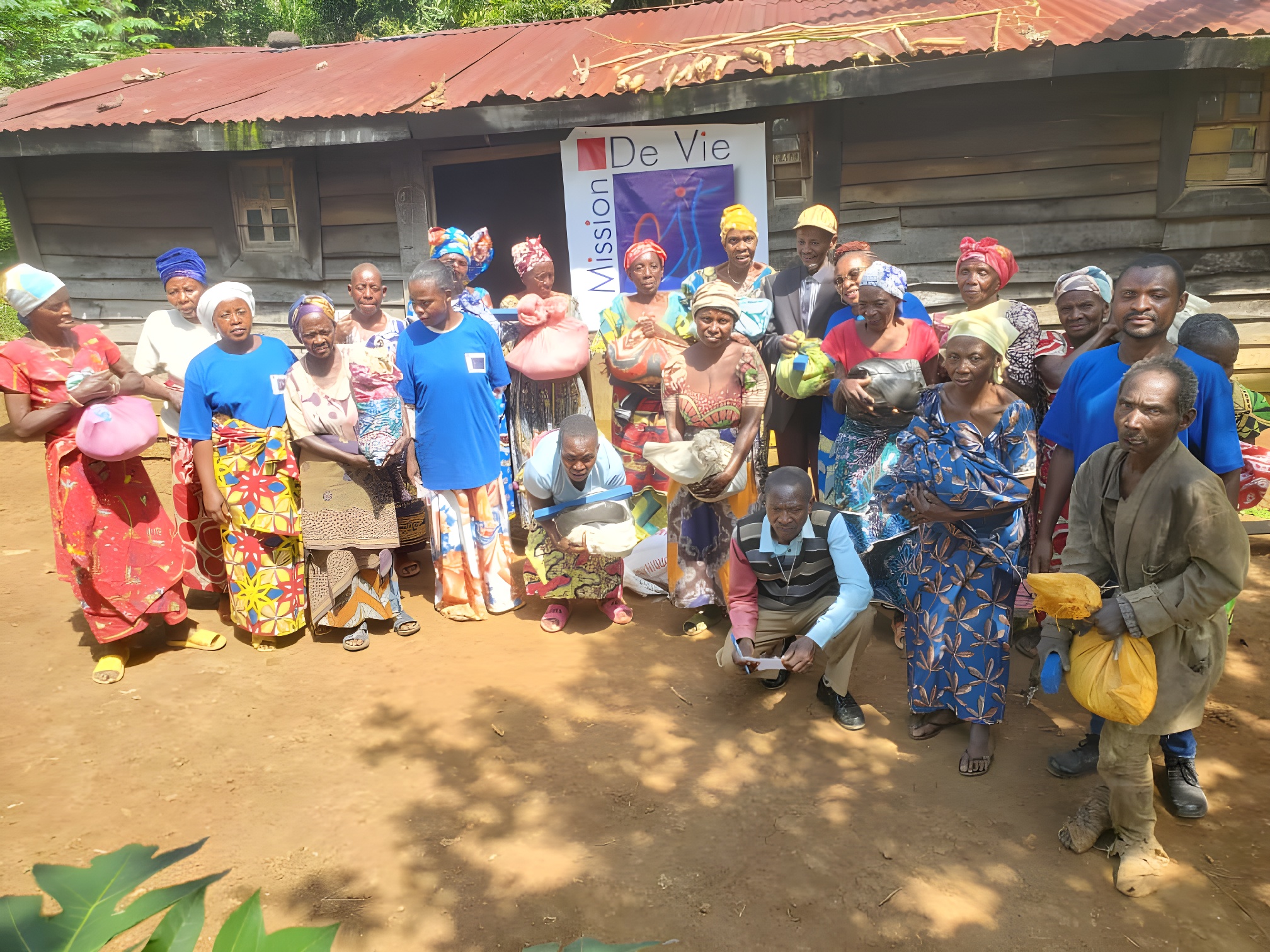 Volunteers organizing clothes donations - International Mission De Vie